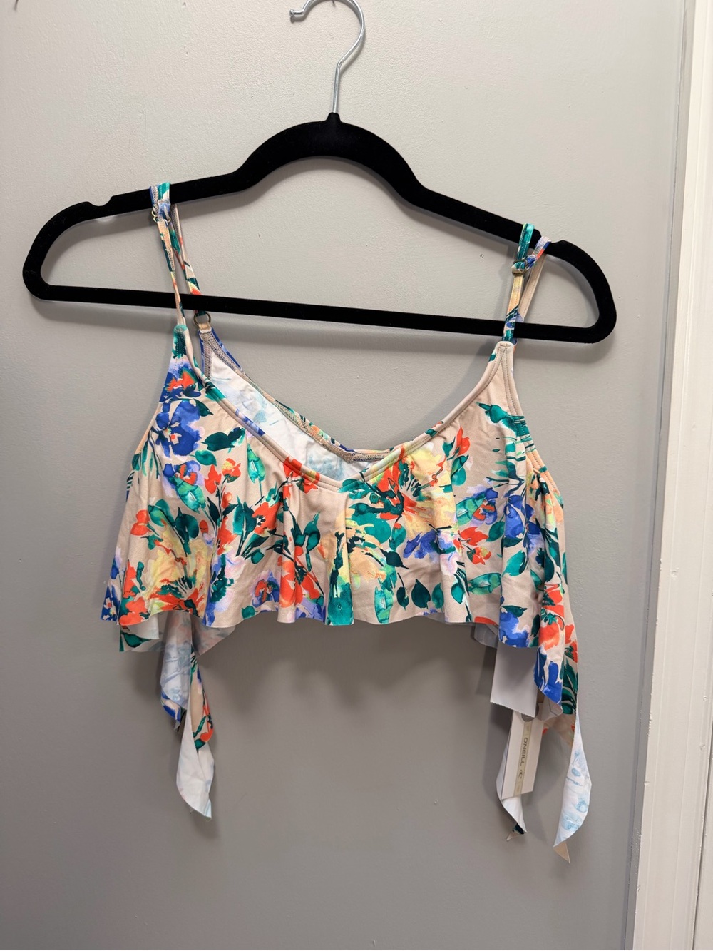 O'Neill “In Bloom” Floral Ruffle Bikini Top in Cream, Blue, Green, Orange